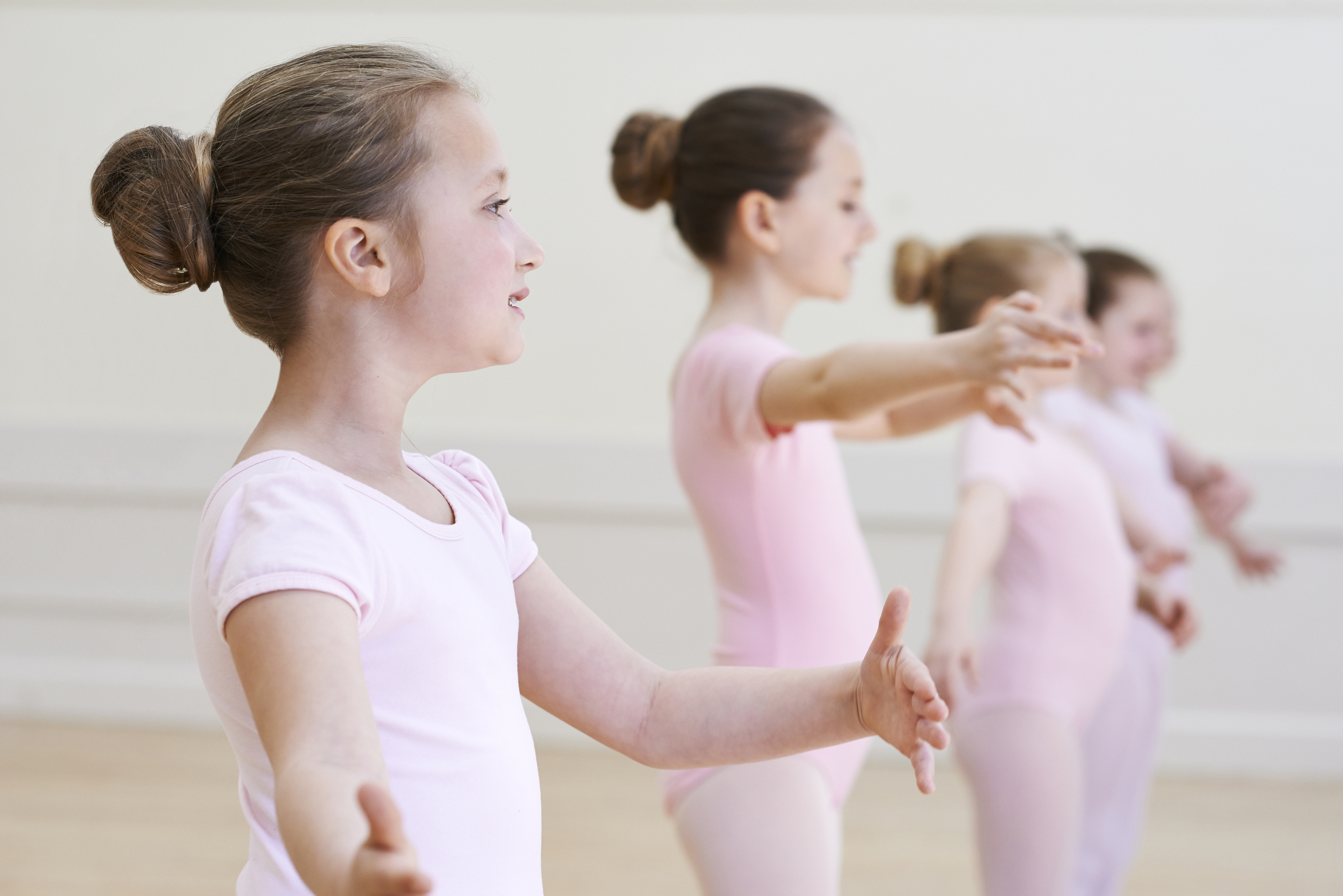 Group Of Young Girls In Ballet Dancing Class