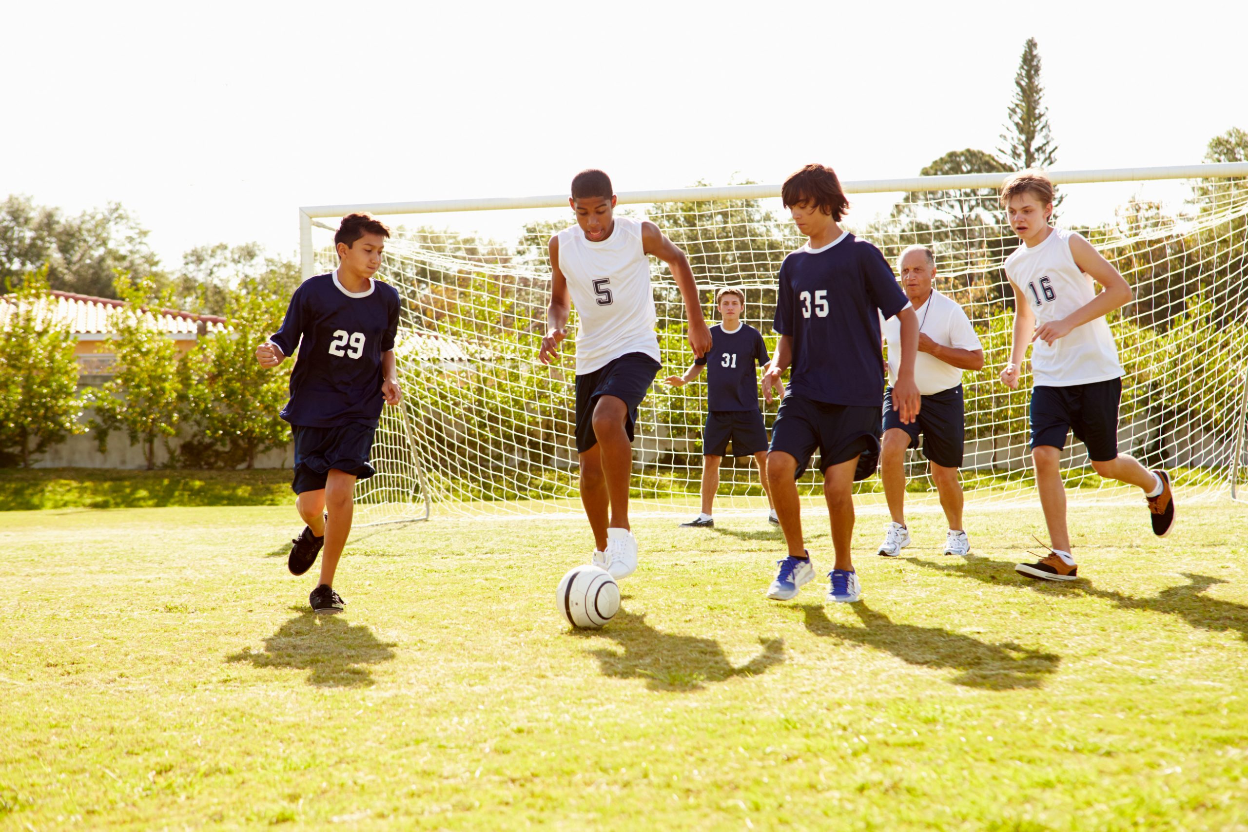 Male High School Soccer Playing Match